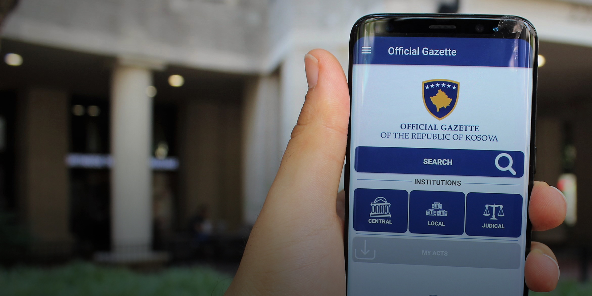 A phone displays the Official Gazette of Kosovo mobile app