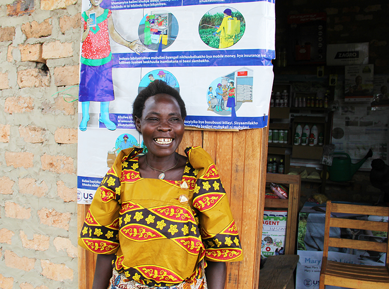 After working with a village agent, Farmer Maria Goretti Masala has seen her crop yields increase by approximately 400 percent. 