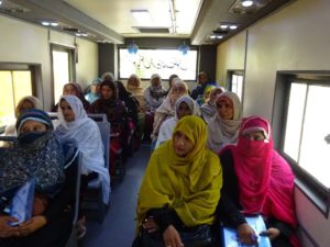 Participants in the Pakistan PEEP program on one of the mobile training buses