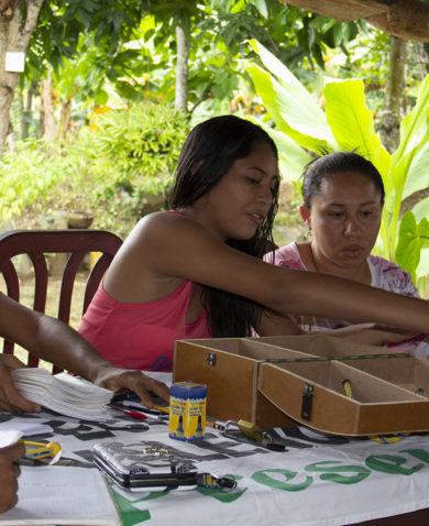 Women meet as part of a community savings group in Colombia.