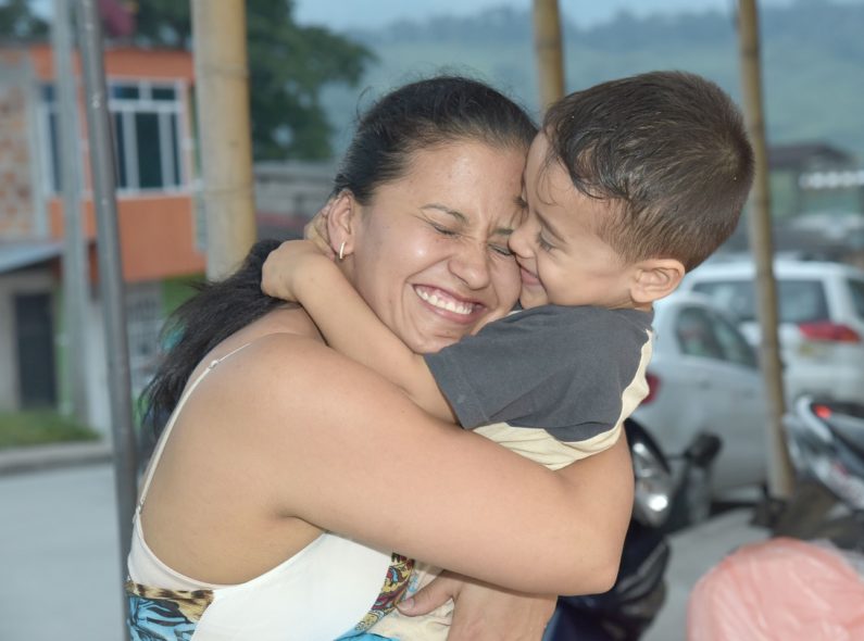 Colombian mother hugging child