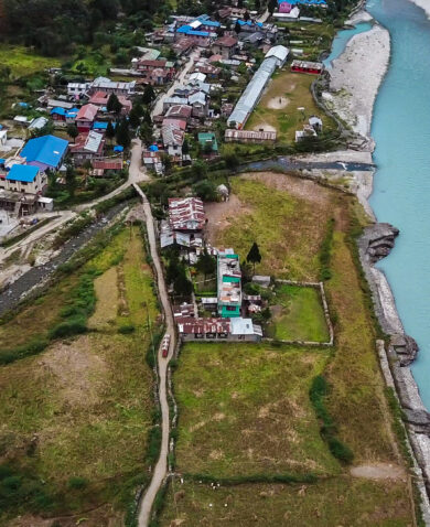 Overhead image of a Nepalese community situated next to a river.