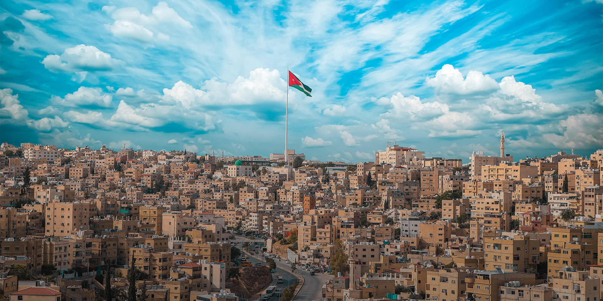 Skyline of Aman, Jordan with Jordanian flag
