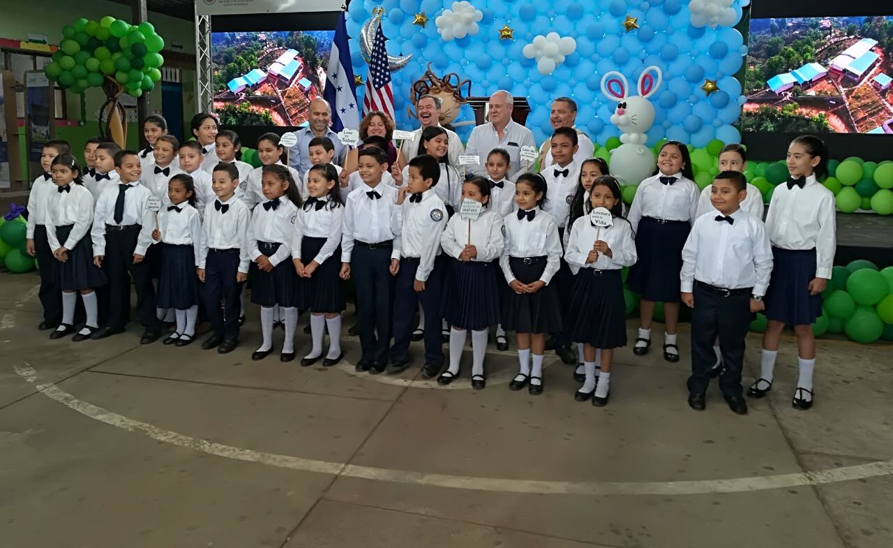 A group of schoolchildren pose for a photo